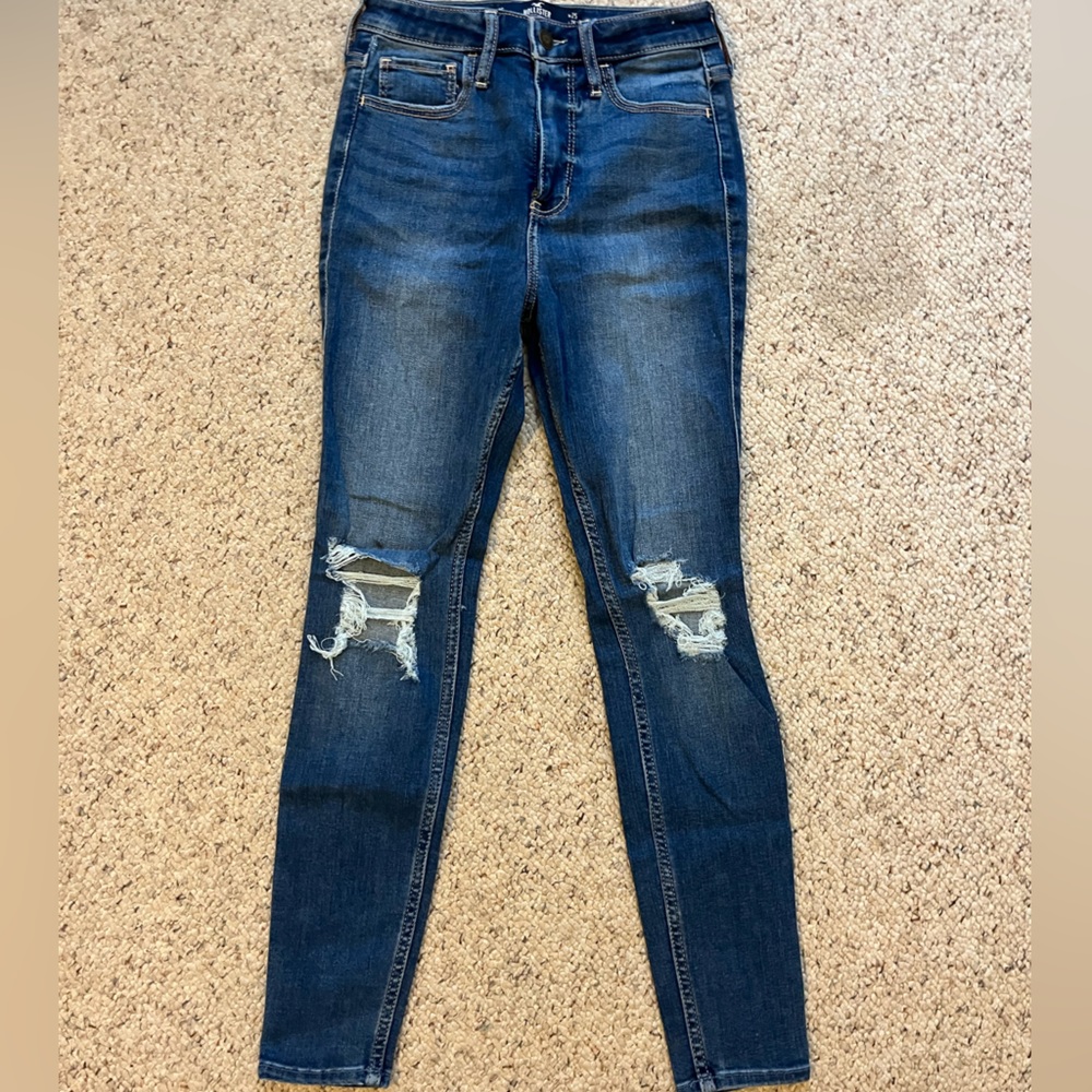 Faded darker wash skinny jeans with rips